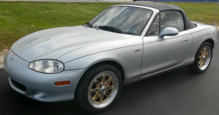 2003 Mazda Miata with 16x7 White Diamond 8008 Gold